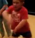 dancing boy in red shirt
